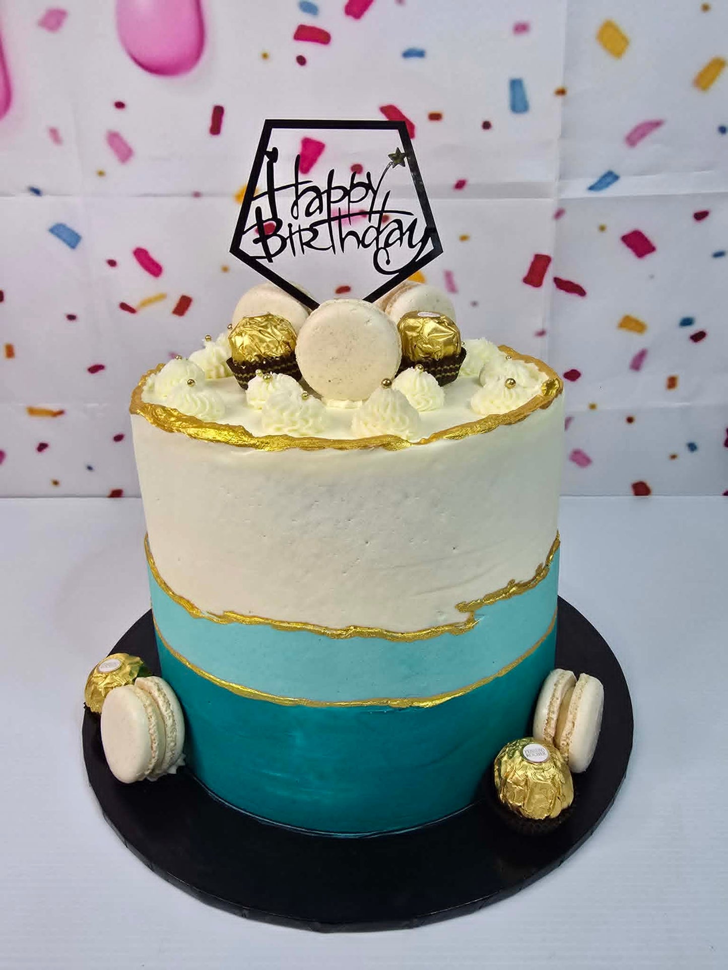 Teal and White Cake with Chocolates and Macarons