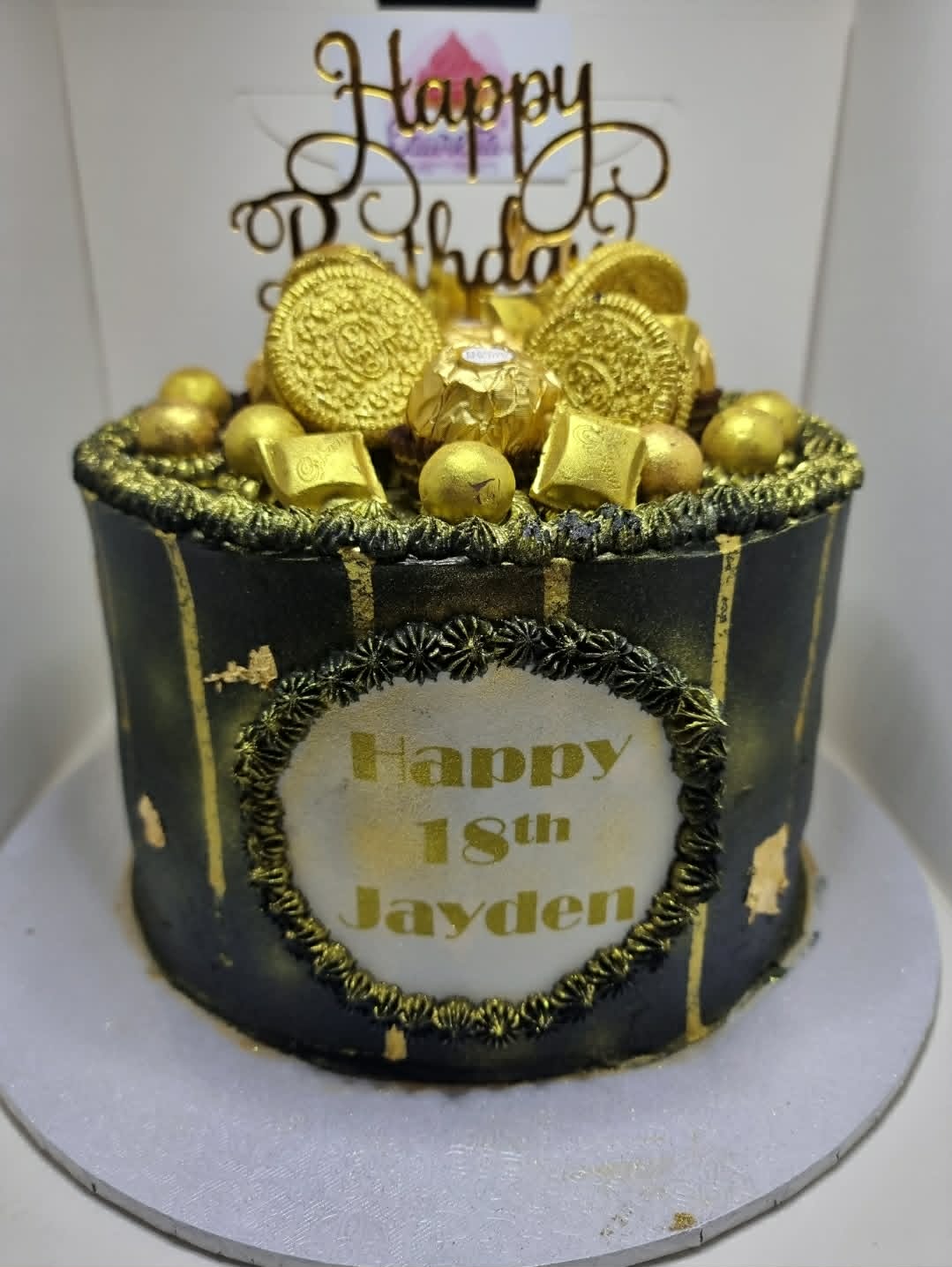 Black and Gold Cake with Chocolates