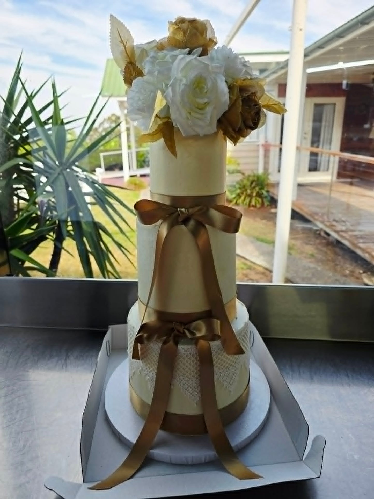 3 tier wedding cake with gold