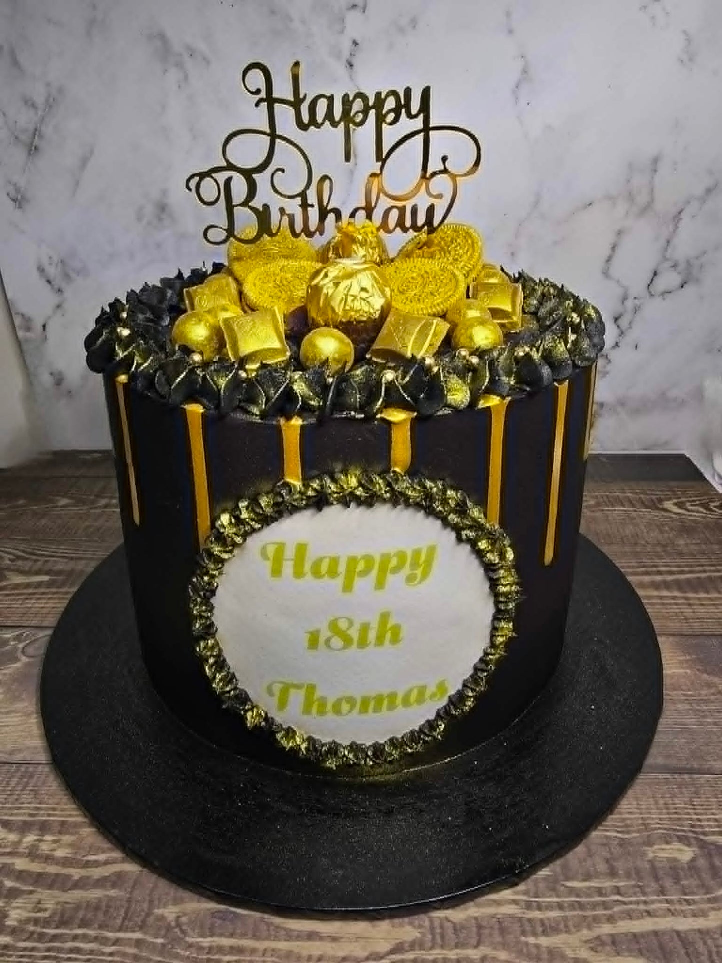 Black and Gold Cake with Chocolates