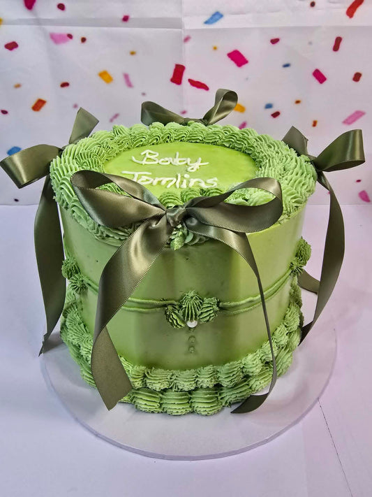 Green vintage cake with bows
