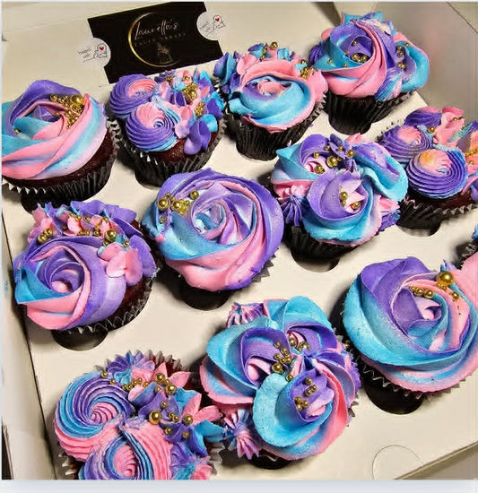 Colorful cupcakes with swirl frosting in a box