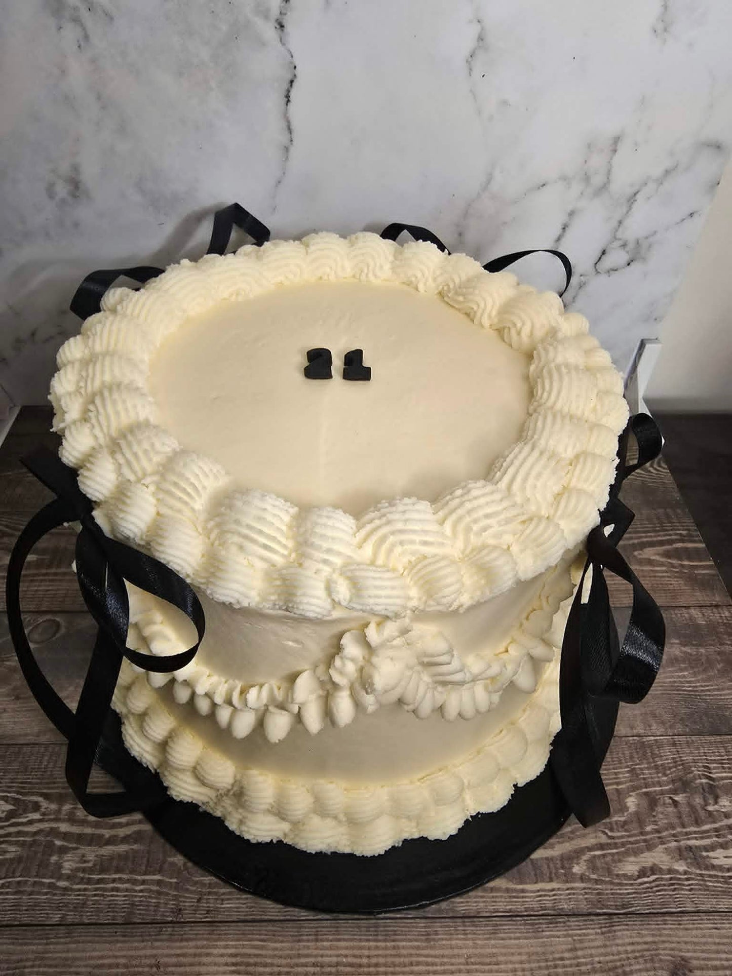 White vintage cake with black bows